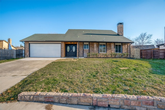 single story home featuring a garage and a front lawn