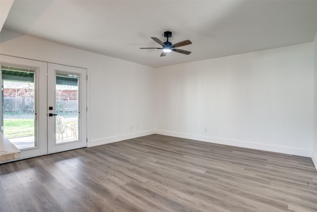 unfurnished room with french doors, ceiling fan, and light hardwood / wood-style floors