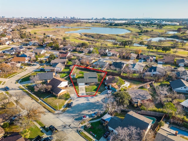 birds eye view of property featuring a water view