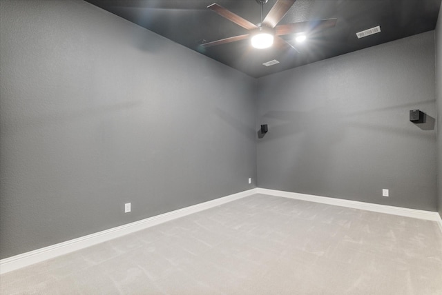 unfurnished room featuring ceiling fan and carpet