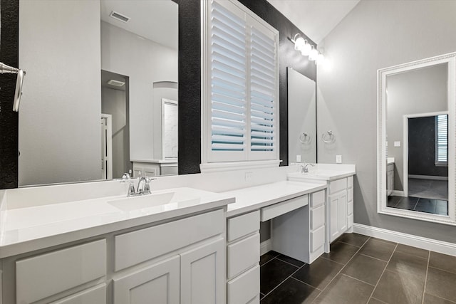 full bathroom with lofted ceiling, tile patterned flooring, double vanity, and a sink
