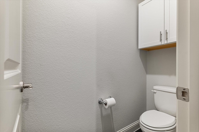 bathroom featuring toilet