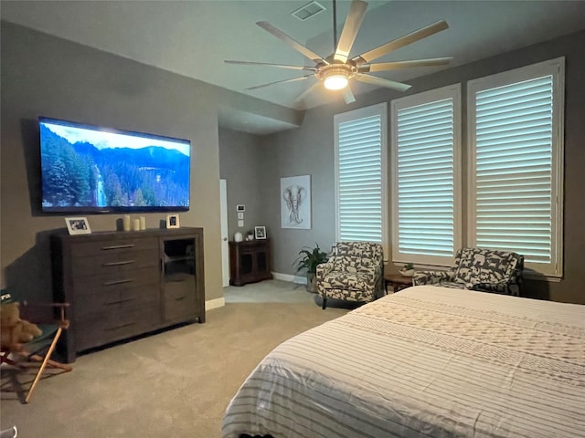 carpeted bedroom with ceiling fan and visible vents