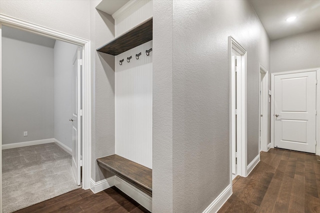 mudroom with wood finished floors and baseboards
