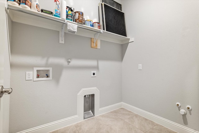 laundry room with gas dryer hookup, tile patterned flooring, hookup for a washing machine, and hookup for an electric dryer