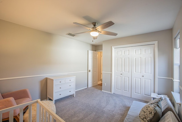 bedroom featuring light carpet, a closet, and ceiling fan