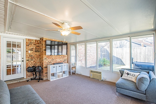 sunroom featuring ceiling fan and a wall mounted air conditioner