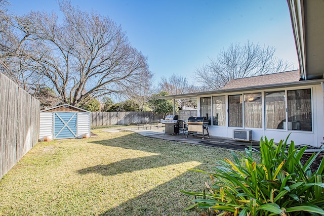 view of yard featuring a storage shed, a sunroom, and a patio area