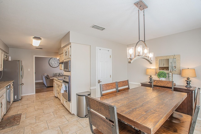 dining area with a chandelier