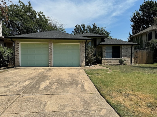 view of front of home with a garage and a front yard