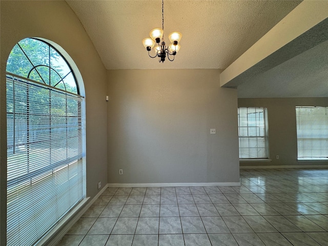 unfurnished dining area with a notable chandelier, lofted ceiling, a textured ceiling, and light tile patterned floors