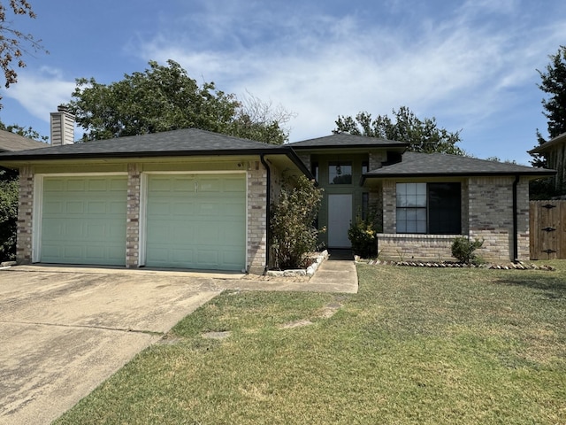 view of front facade with a front lawn and a garage