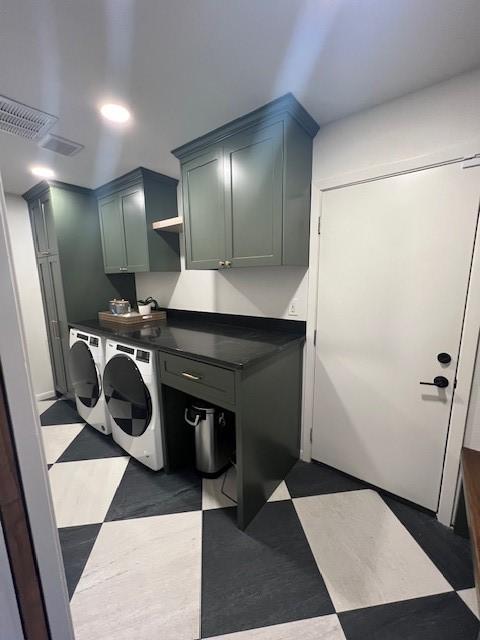 laundry area with cabinets and independent washer and dryer