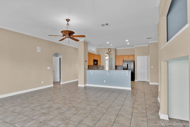 unfurnished living room with light tile patterned floors, crown molding, and ceiling fan