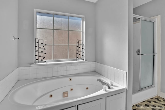 bathroom with shower with separate bathtub