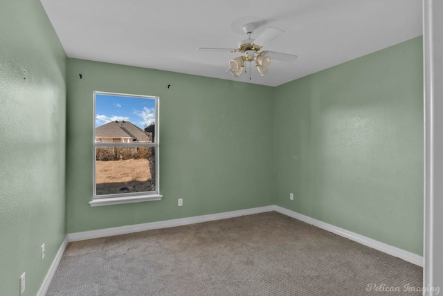 carpeted spare room with ceiling fan