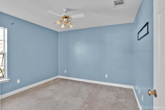 carpeted empty room featuring ceiling fan