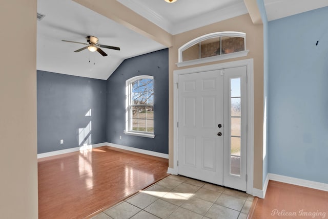 foyer entrance with ceiling fan, lofted ceiling, and light hardwood / wood-style flooring