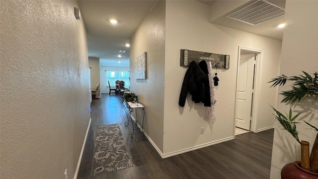 corridor featuring dark hardwood / wood-style floors