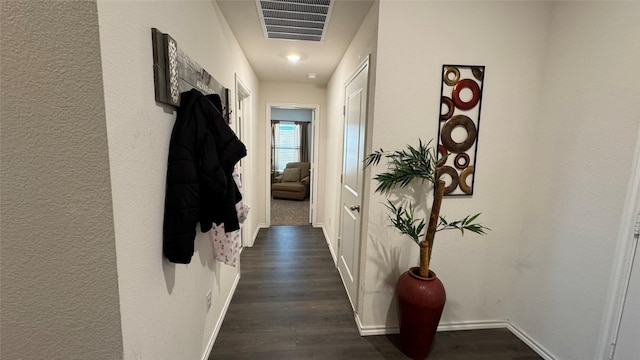 corridor featuring dark hardwood / wood-style floors