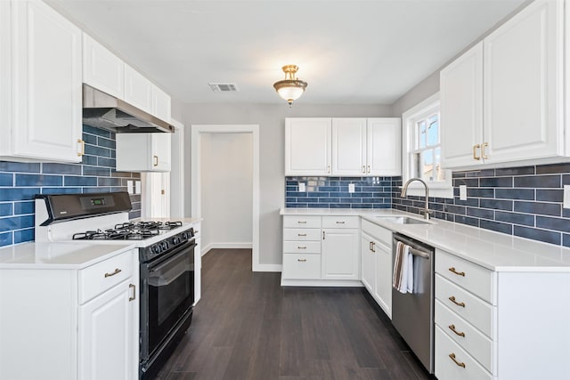 702 N Church St, Decatur, TX 76234 - kitchen with range with gas stovetop, wall chimney exhaust hood, stainless steel dishwasher, a sink, and decorative backsplash