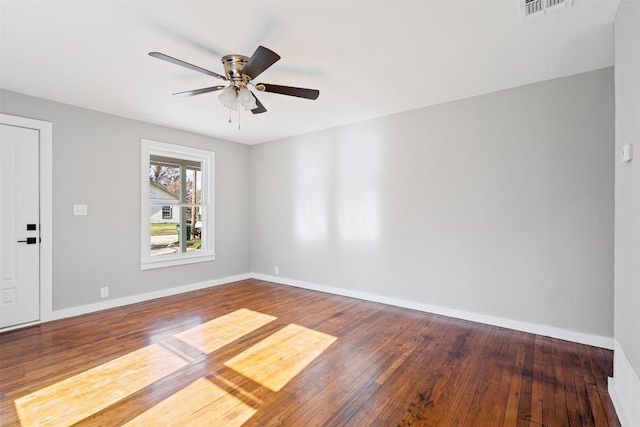 702 N Church St, Decatur, TX 76234 - spare room featuring wood-type flooring, baseboards, and a ceiling fan