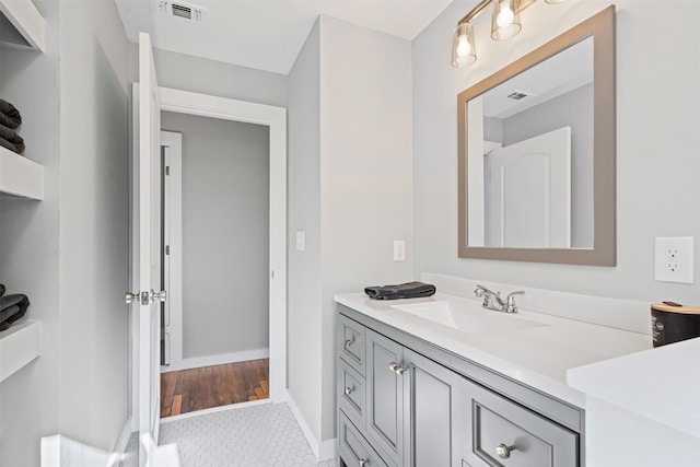702 N Church St, Decatur, TX 76234 - bathroom featuring vanity, baseboards, and tile patterned flooring