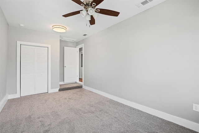 unfurnished bedroom with light carpet, a closet, and ceiling fan