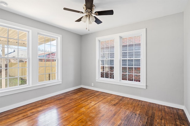 702 N Church St, Decatur, TX 76234 - empty room featuring hardwood / wood-style flooring, baseboards, healthy amount of natural light, and ceiling fan
