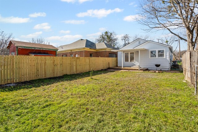 702 N Church St, Decatur, TX 76234 - rear view of property with a fenced backyard and french doors