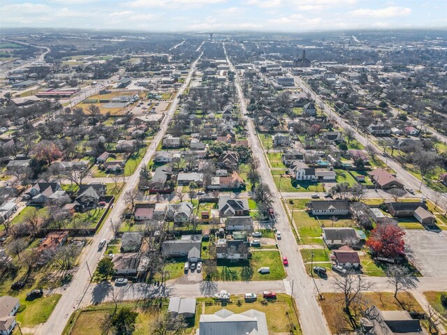 702 N Church St, Decatur, TX 76234 - aerial view of property and surrounding area with nearby suburban area