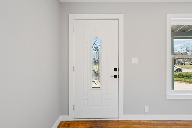 702 N Church St, Decatur, TX 76234 - foyer with baseboards, plenty of natural light, and wood finished floors