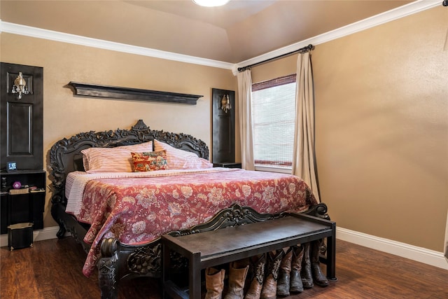 bedroom with crown molding, lofted ceiling, and dark wood-type flooring