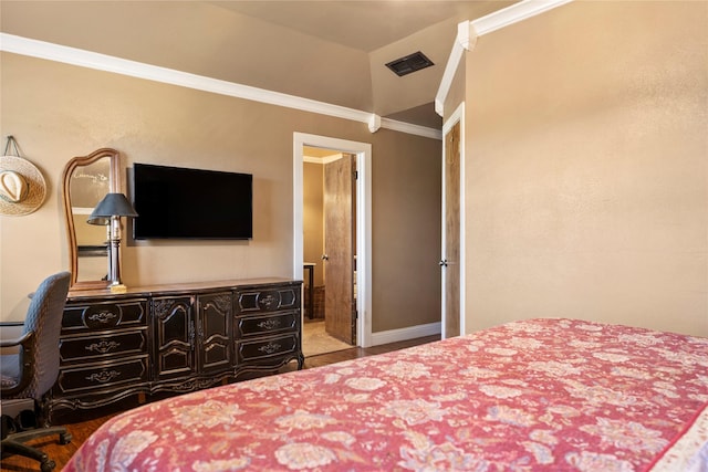 bedroom featuring wood-type flooring, ornamental molding, and vaulted ceiling