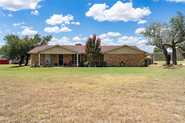 ranch-style home with a front lawn