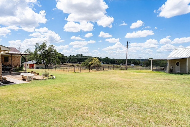 view of yard with a rural view