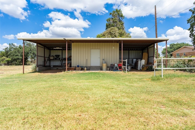 view of outbuilding with a yard