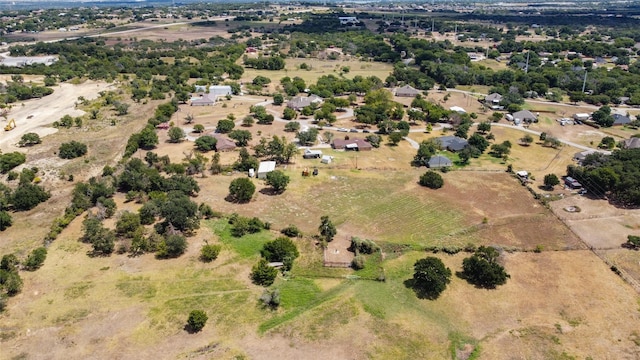 birds eye view of property with a rural view