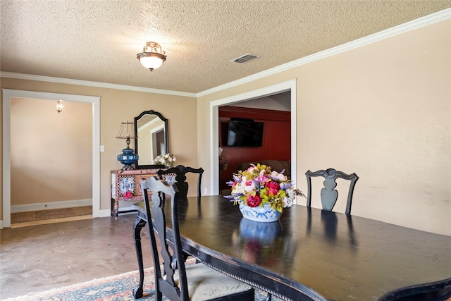 dining room with concrete flooring, a textured ceiling, and crown molding