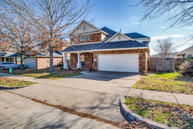 view of front of property featuring a garage, central AC, and covered porch