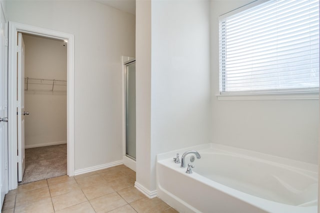 bathroom featuring tile patterned floors and plus walk in shower