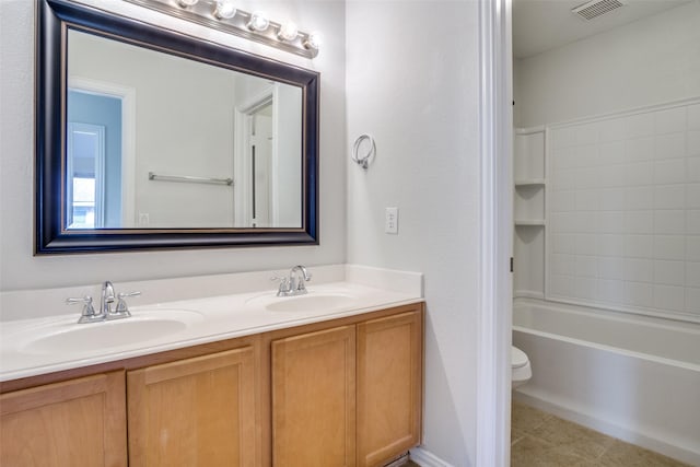 full bathroom with tile patterned flooring, vanity, shower / bath combination, and toilet