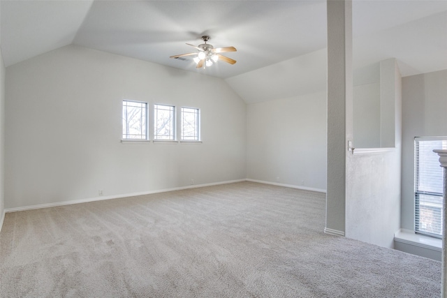 bonus room with light colored carpet, vaulted ceiling, and ceiling fan