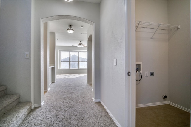 hall featuring carpet flooring