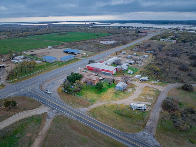 aerial view with a rural view and a water view