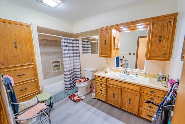 full bathroom with decorative backsplash, hardwood / wood-style flooring, vanity, shower / tub combo, and toilet