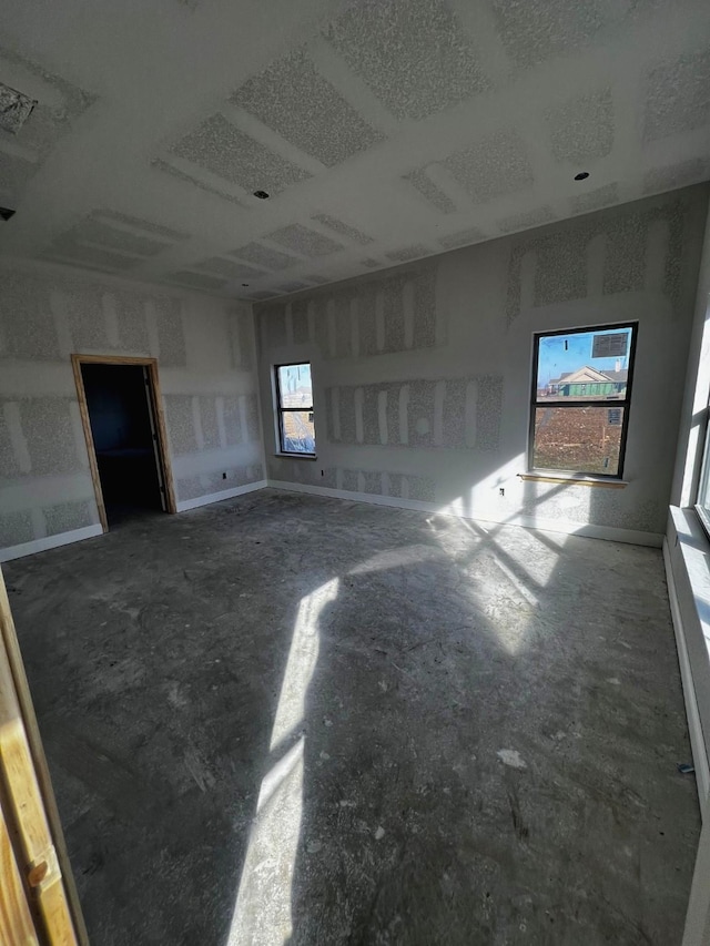 unfurnished room featuring a wealth of natural light