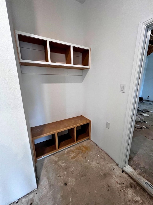 mudroom with concrete flooring