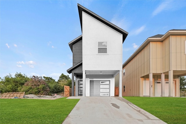 view of front of house featuring a front yard and a garage