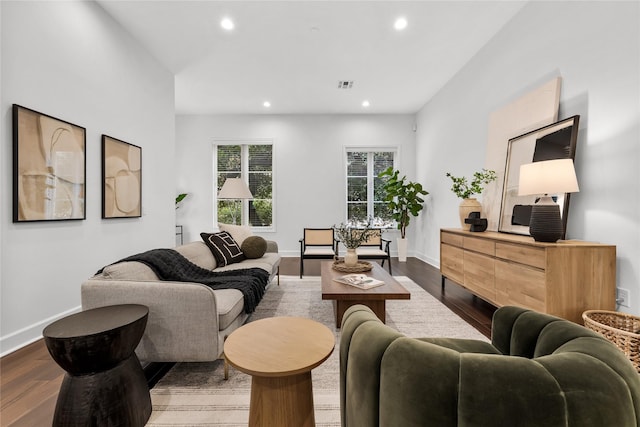 living room with recessed lighting, dark wood-style flooring, visible vents, and baseboards